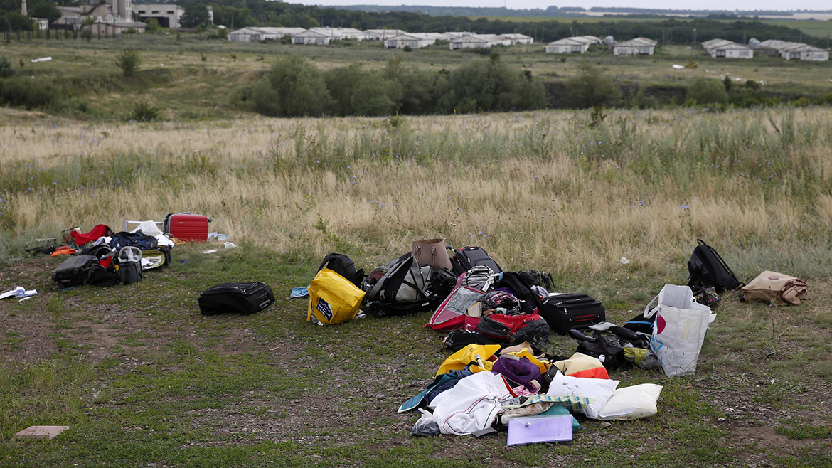 Luggage and belongings are seen near the site of Thursday's Malaysia Airlines Boeing 777 plane crash, near the settlement of Grabovo in the Donetsk region