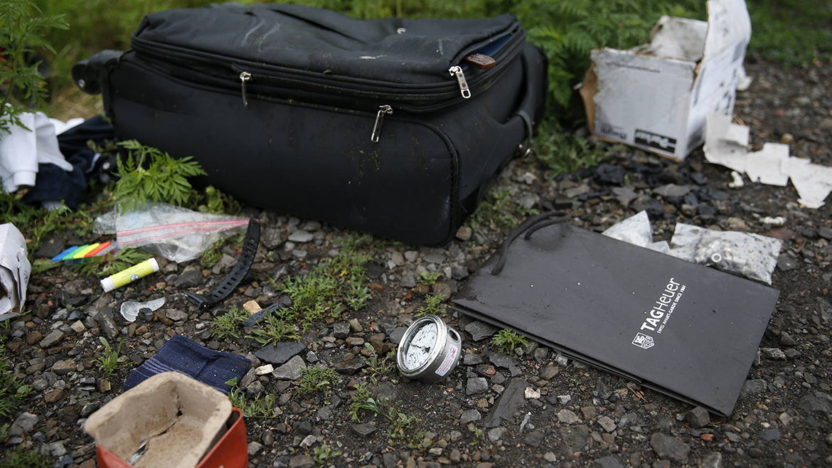 Personal belongings from a Malaysian Airlines Boeing 777 plane which was downed on Thursday are seen near the village of Rozsypne