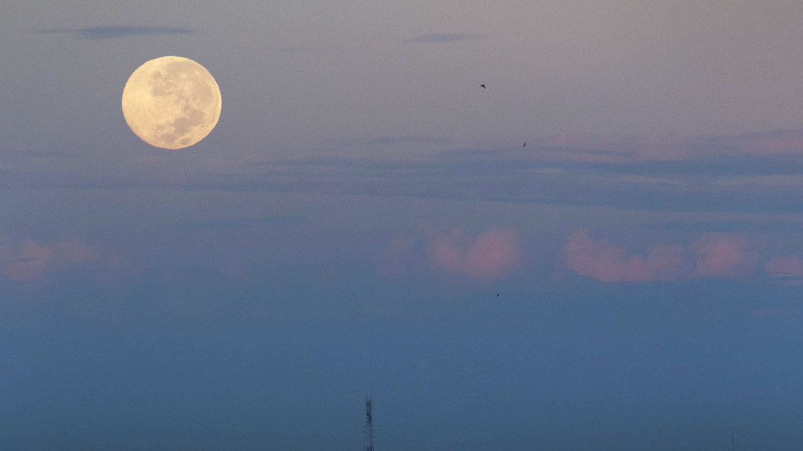 A supermoon is seen over downtown Bangkok