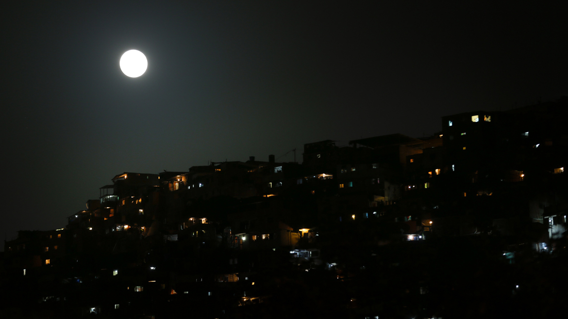 Supermoon raises over Petare slum in Caracas