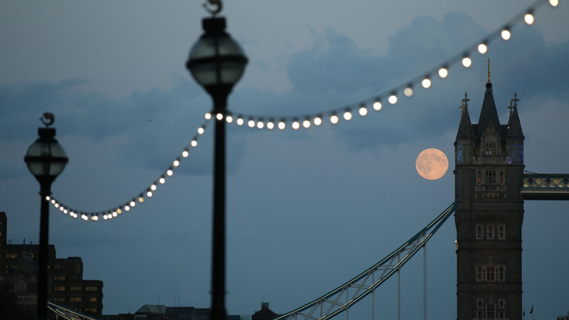 The supermoon rises over Tower Bridge in London