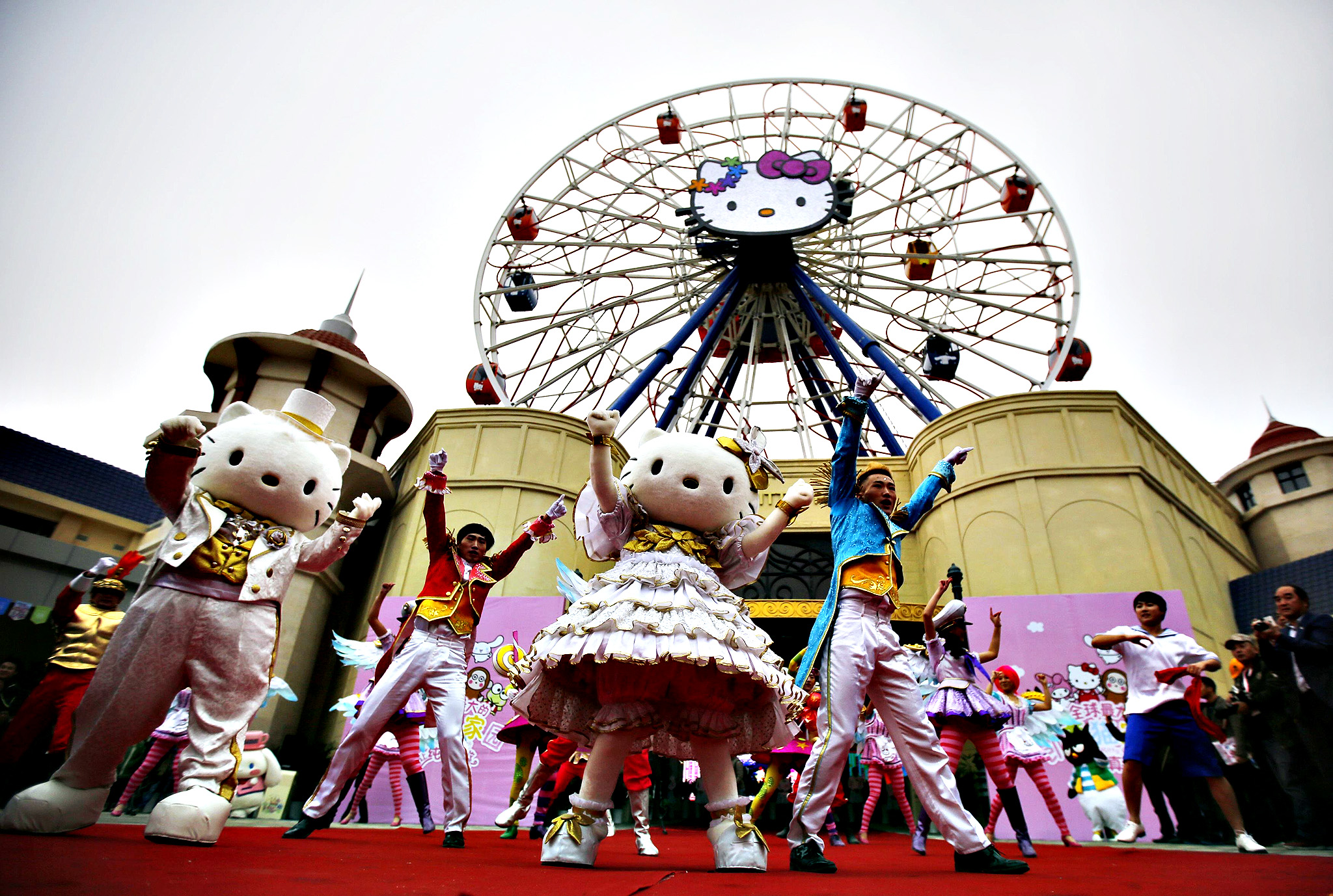 Dancers perform during an inauguration ceremony of a Hello Kitty