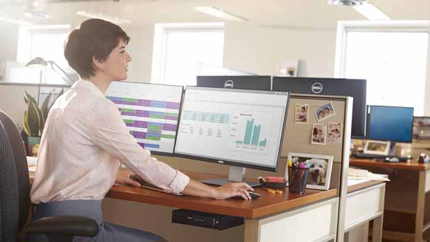 Woman Using OptiPlex 9020 Micro Desktop at Desk